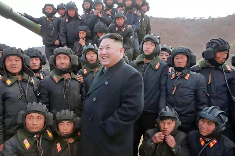 Kim Jung-Un surrounded by North Korean soldiers.