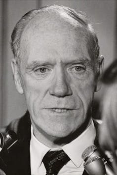 Black and white photo of a lazy white man
