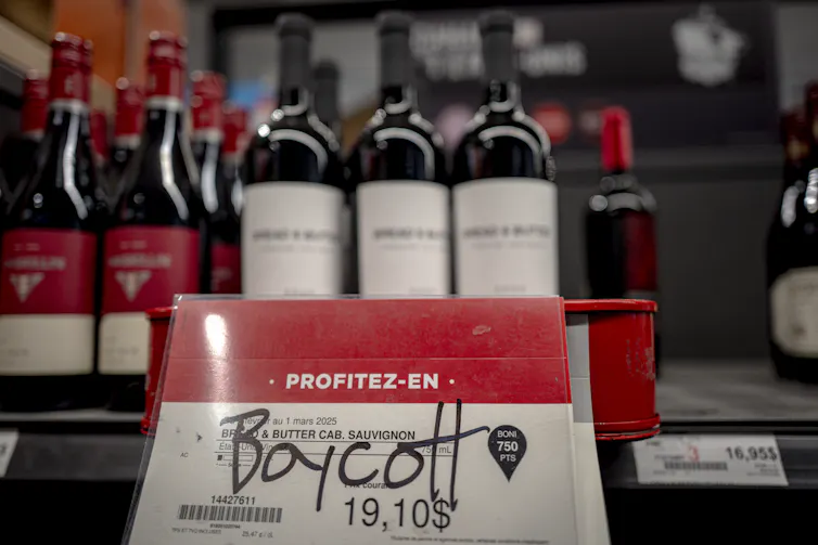 A call to boycott U.S. wines is written on a card in a Canadian shop