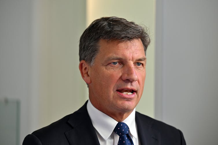 Headshot of man in a suit