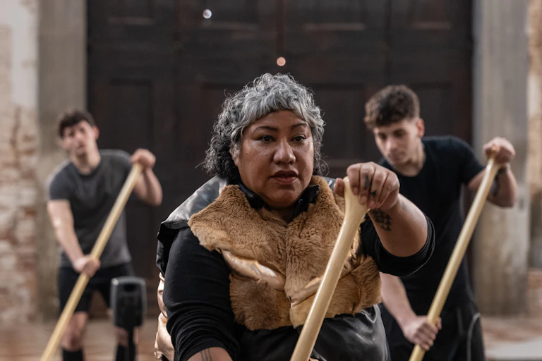 A Pacifica woman oars in a gallery.