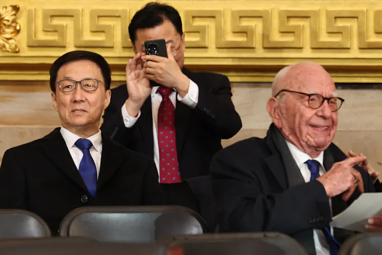 Chinese vice-president, Han Zheng, sits behind media tycoon Rupert Murdoch at Dona;ld Trump's inauguration, January 2025.