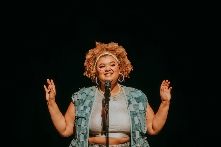 A woman at a microphone.