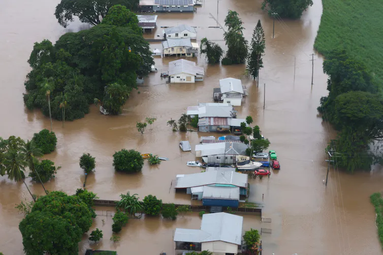 Flooding is seen from a helicopter in the Cardwell area in North Queensland, Tuesday