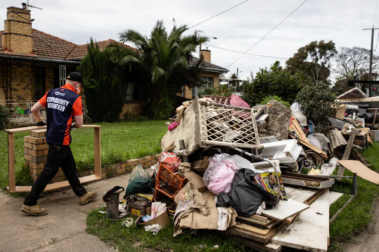 Flood damaged belongings outside houses in the suburb of Maribyrnong, Melbourne
