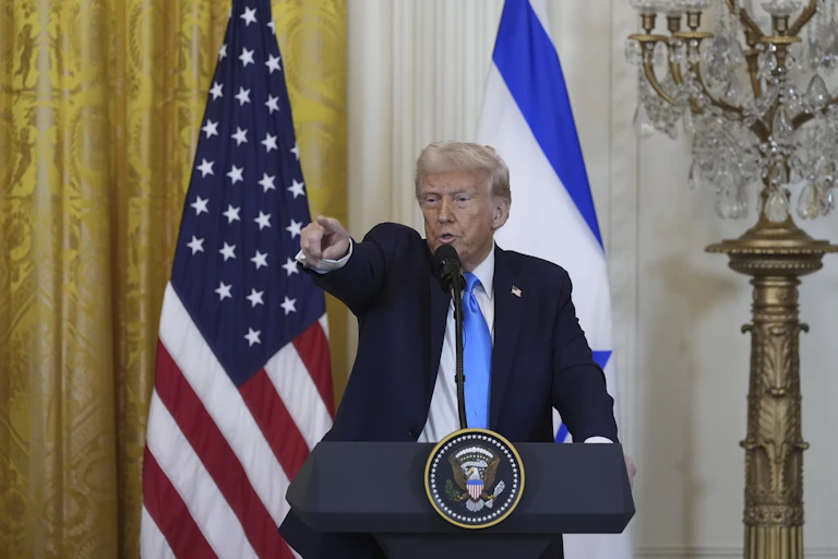 Donald Trump standing and pointing