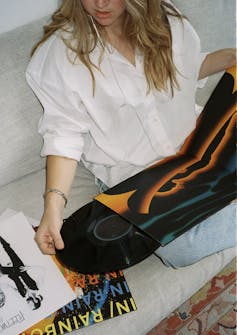 Woman listening to vinyl records