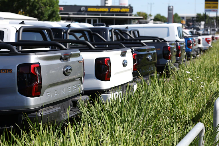 Row of utes in a car dealership yard