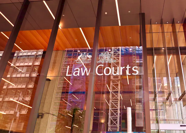 A glass building exterior that says Law Courts