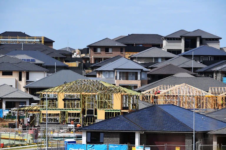 Houses, some finished and some being built.