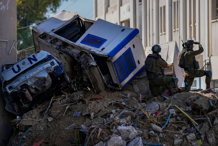 The remains of an UNRWA truck on a pile of rubble in Gaza, February 2024.