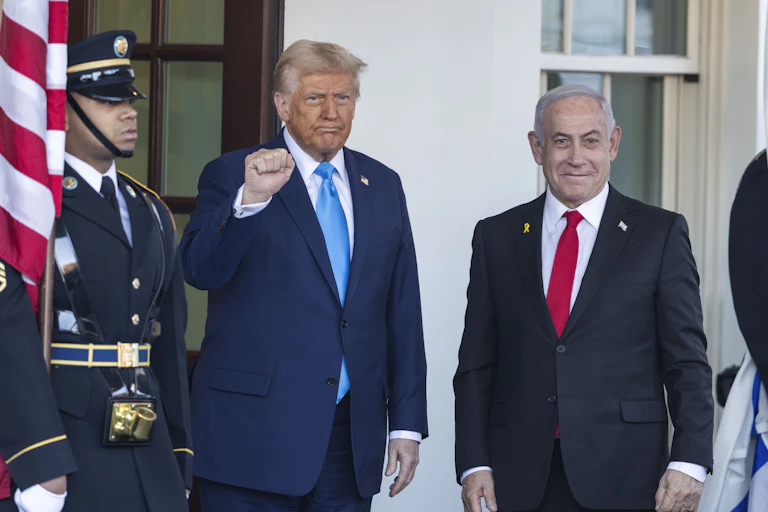 Trump and Netanyahu standing next to each other as they pose for a photograph.