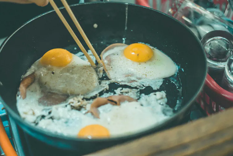 Eggs frying in a pan