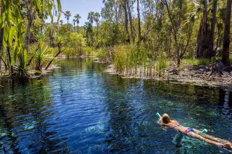 woman swims in springs