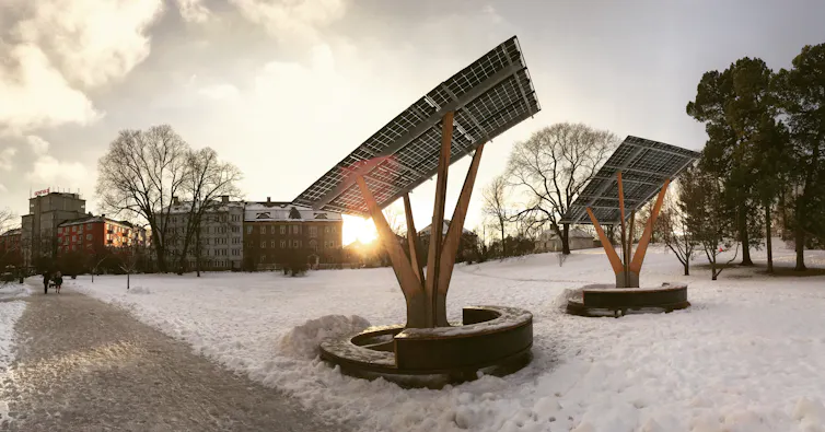 solar panels in a snowy city park