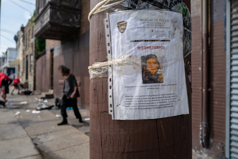 Telephone pole with police report of missing person