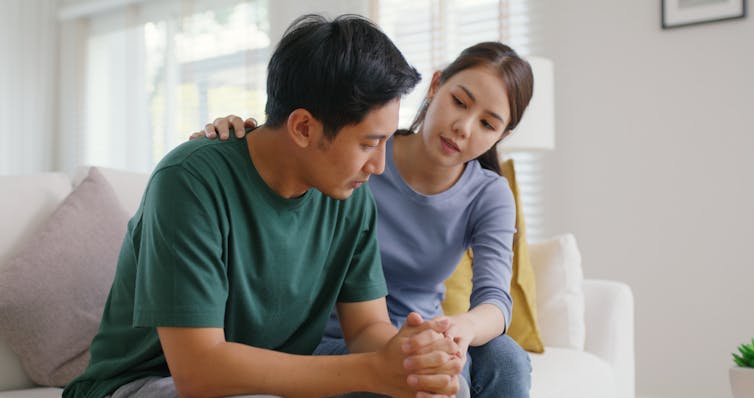The Power of Touch: Why Physical Affection Matters in Romantic Relationships 3 A woman comforts a man as they sit on a couch