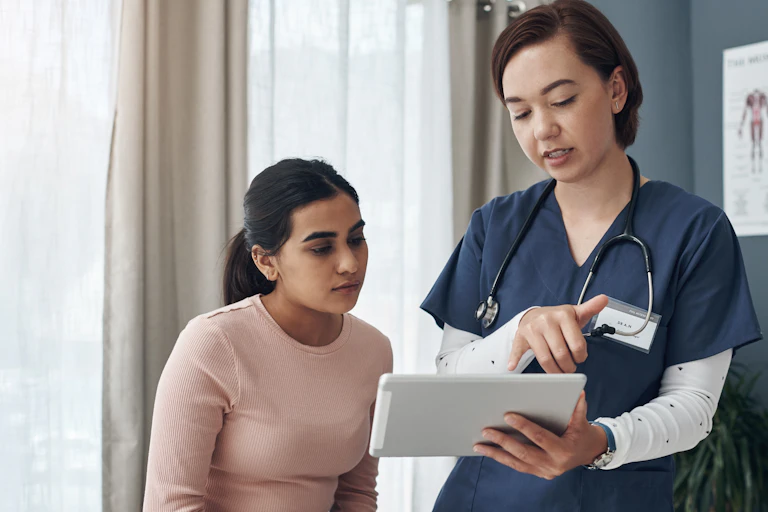 Clinican shows patient information on a tablet