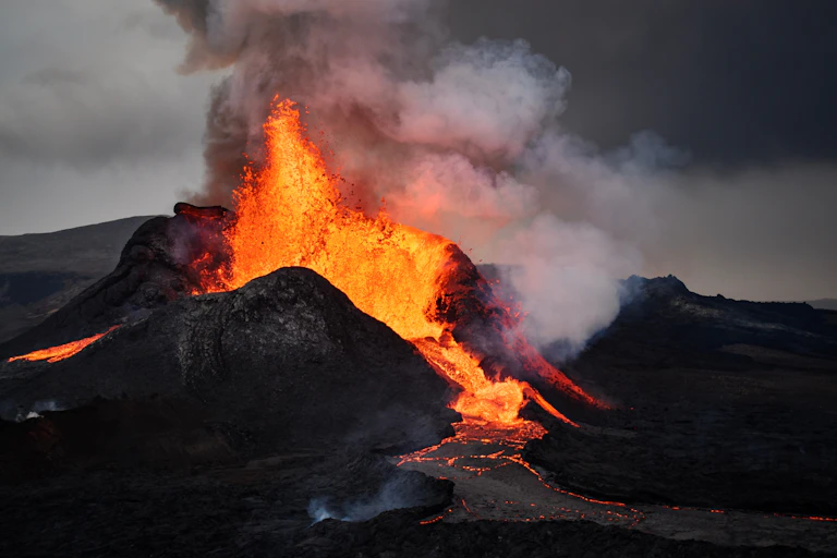 Photo of lava erupting from a volcano.