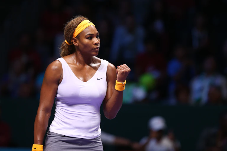 Serena Williams celebrates a point with a clenched fist