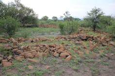 Remains of stone wall in landscape