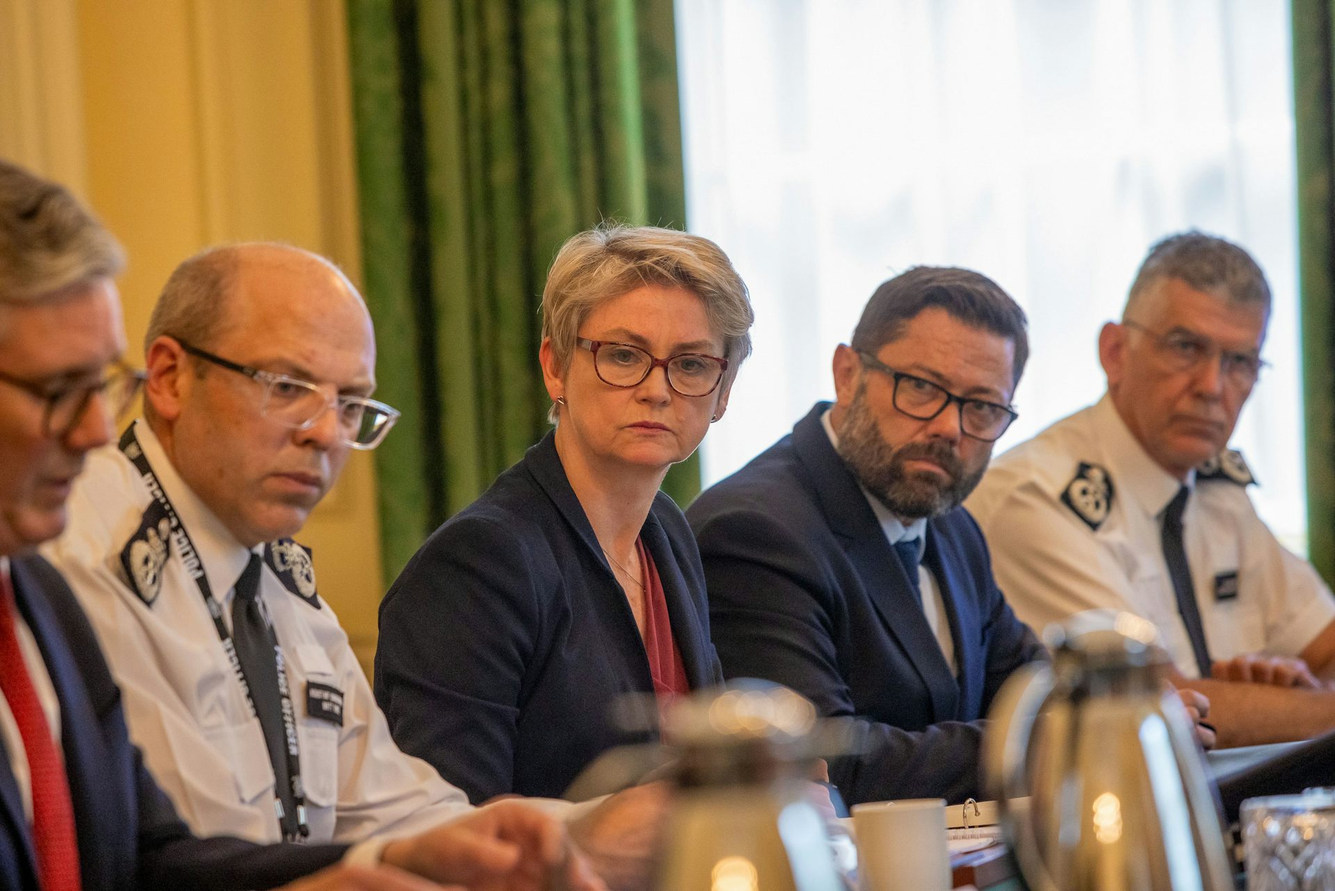 Yvette Cooper and police leaders seated on one side of a long table