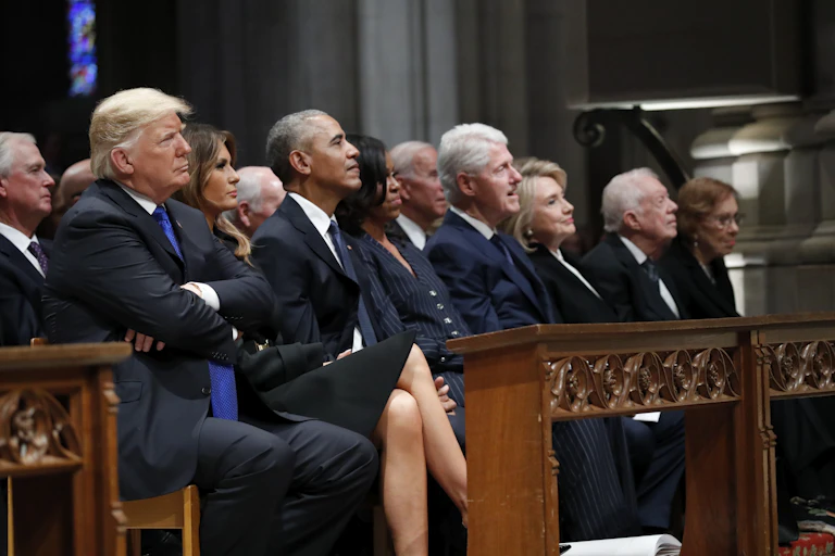 Donald Trump, Barack Obama and Bill Clinton, sitting alongside in a row.