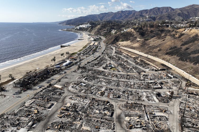 Block after block of a neighborhood next to the ocean has been turned to ash.