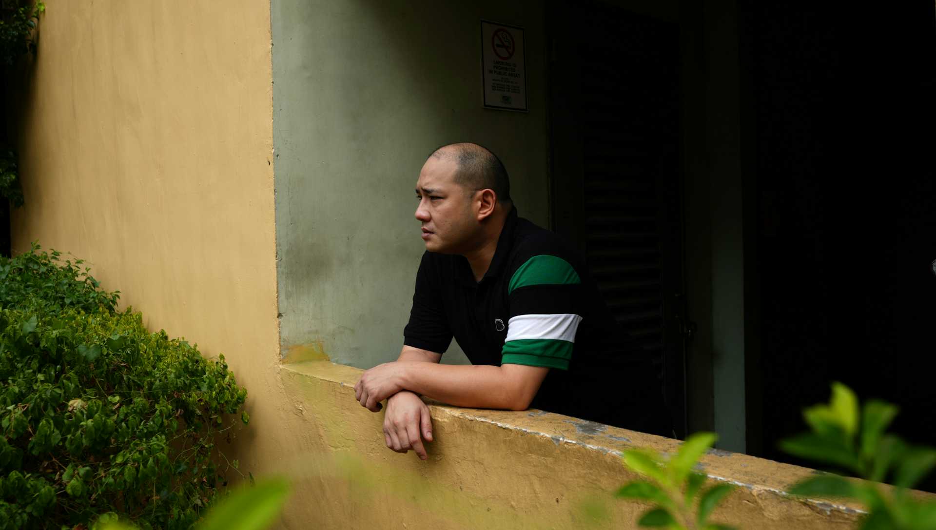 Ben Yeo looks out from a balcony in Manilla.