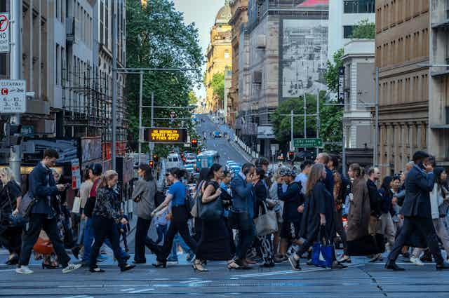 A crowded pedestrian crossing in a city