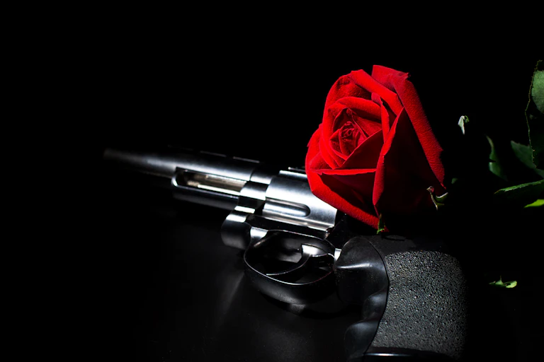 a gun and a rose