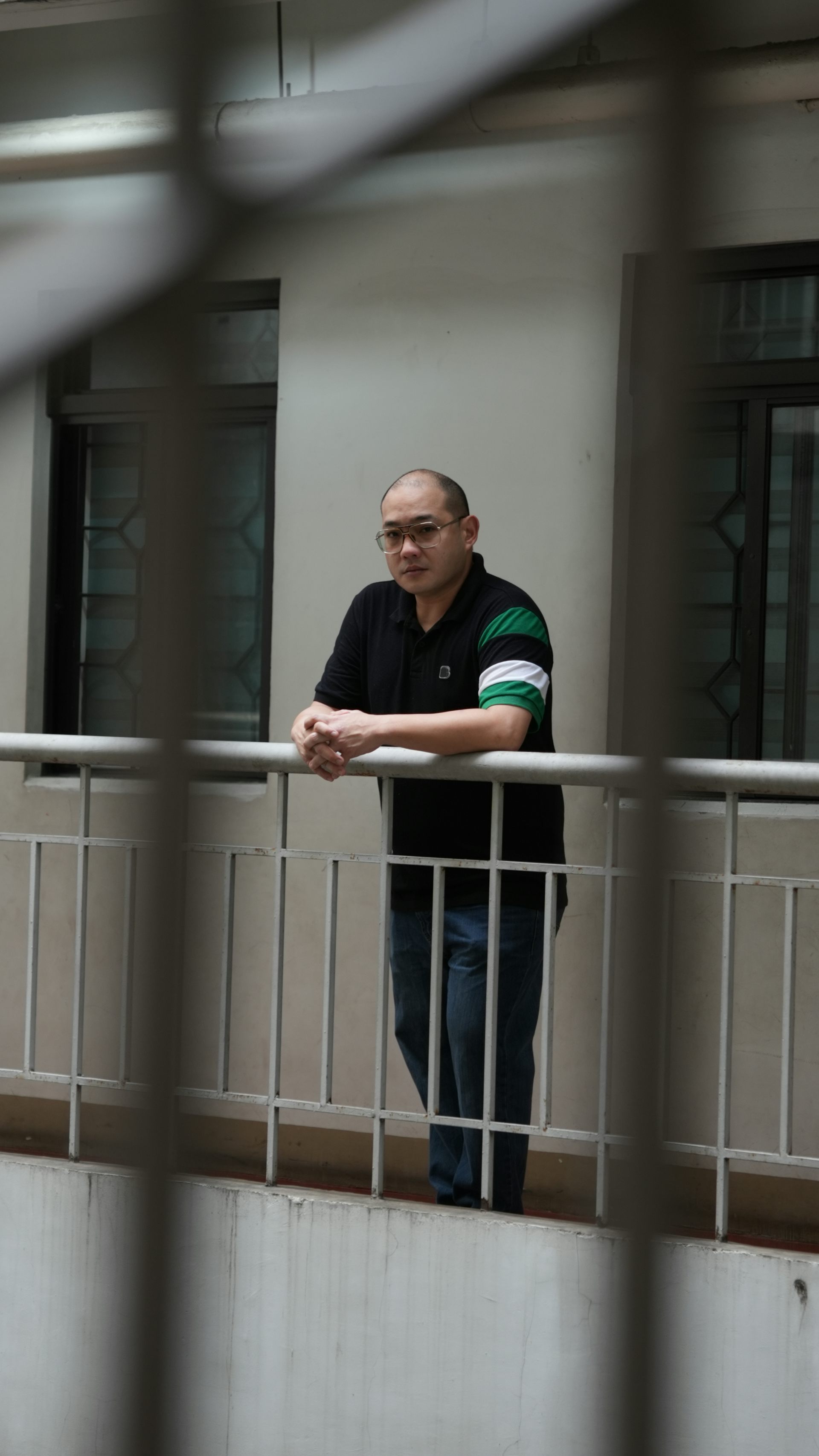 Ben Yeo looks out from a balcony in Manilla.