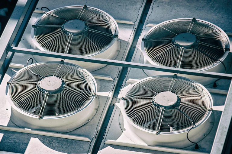 Fan units outside a building.