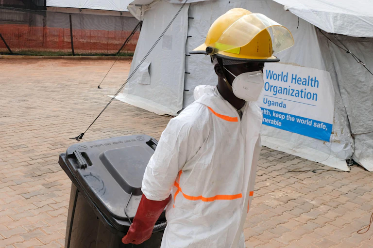 A healthcare worker at a WHO station in Uganda.
