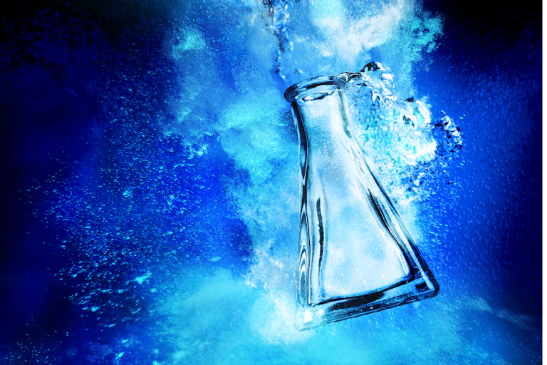 Erlenmeyer flash sinking in dark blue water