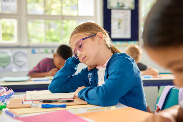Girl looking bored in class
