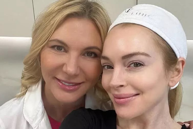 A closeup of two women smiling