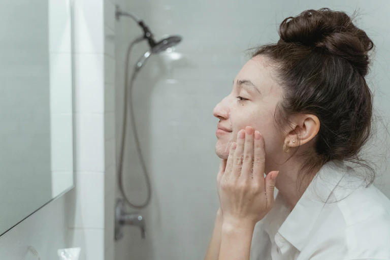 Woman washes face