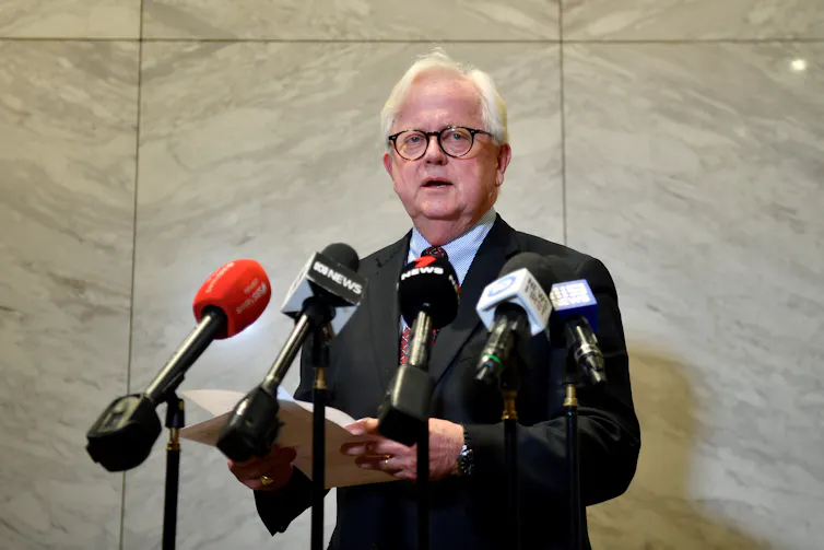 The head of the NSW Independent Casino Commission, Philip Crawford, in 2022 announcing restrictions on Star's operations.