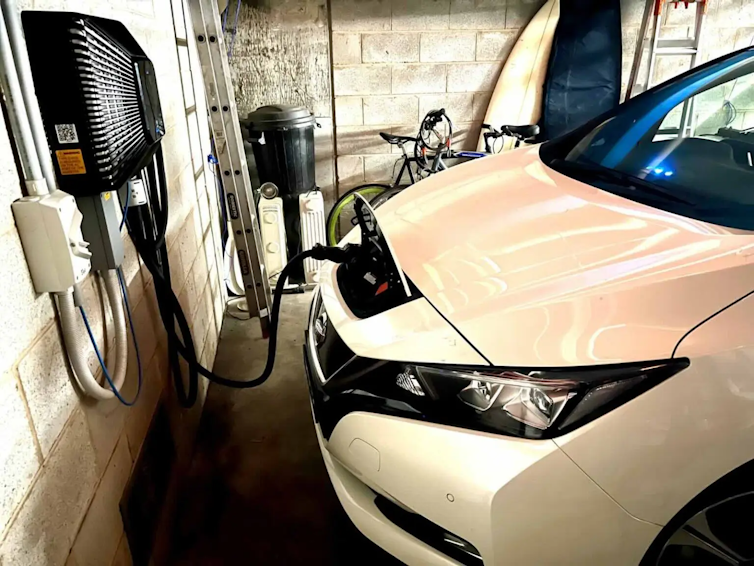 set up of a vehicle to grid user, nissan leaf car charging in garage.