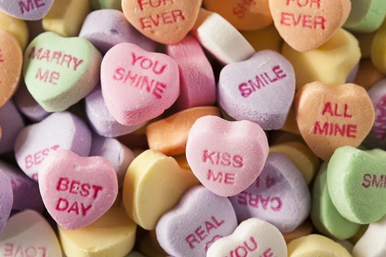 Heart shaped sweets with 'romantic' messages.