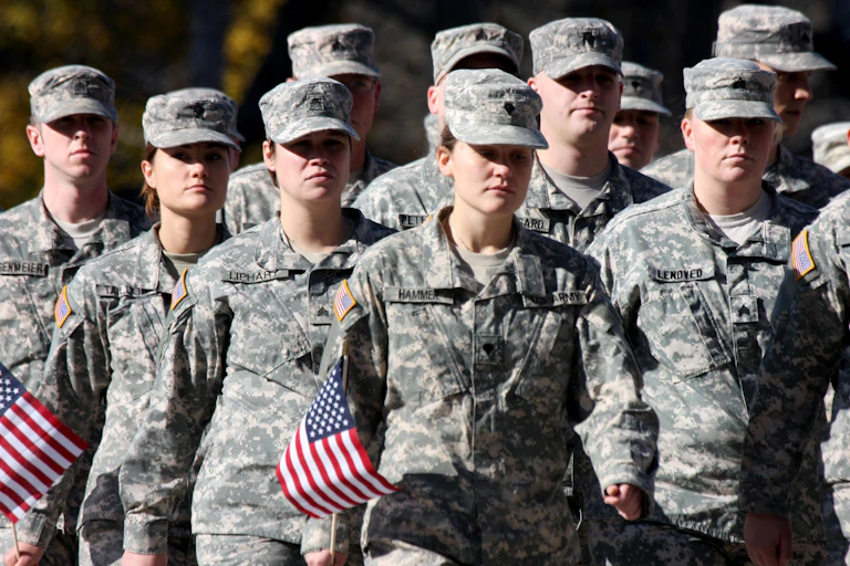 US army veterans marching.