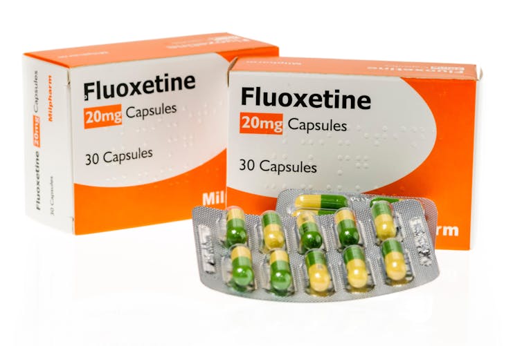 Two boxes and a couple of blister packs of fluoxetine.