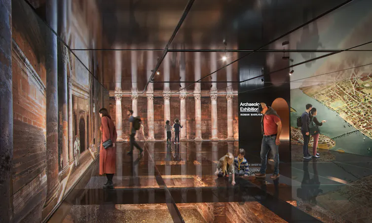 An exhibition space with people looking at replica Roman walls