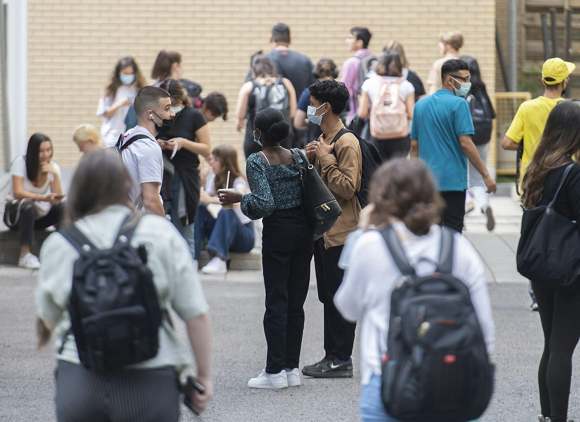 Students standing outside a school.