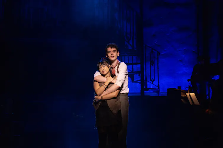 Abigail Adriano and Noah Mullins embrace.