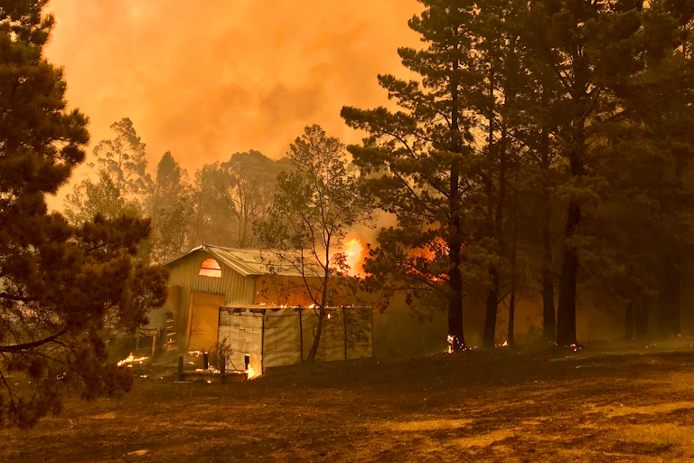 house burning in bushfire.
