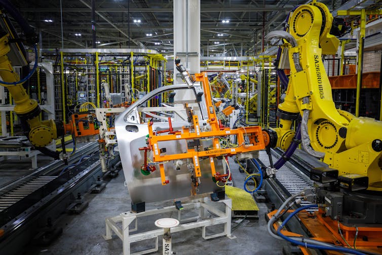 A steel and aluminium door is welded in a factory.