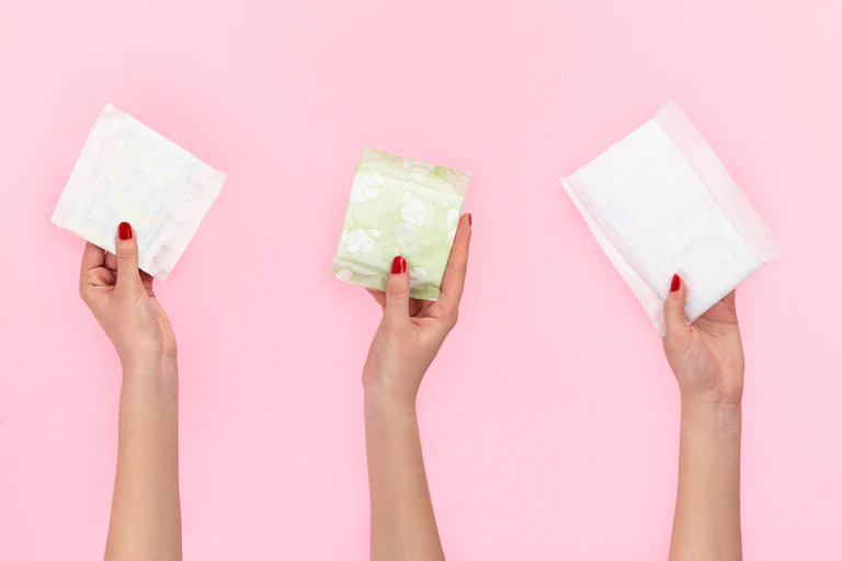 hands holding sanitary pads