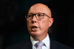 Man speaking at a microphone